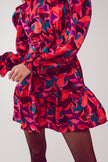 Mini-robe à manches bouffantes en fuchsia