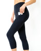 Jolie legging capri taille haute avec poches sur les hanches