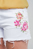 Short en jean blanc à fleurs brodées