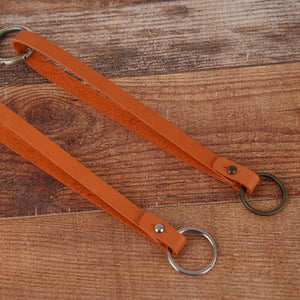 Lanière en cuir pour clés en orange pour sécuriser les clés des sacs à main.
